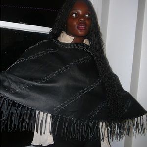 Genuine leather vintage poncho w/ beautiful fringes at the end.